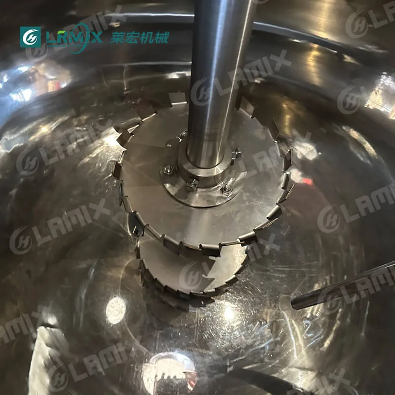 Detailed view of the high shear serrated dispersing disc inside the vacuum mixer